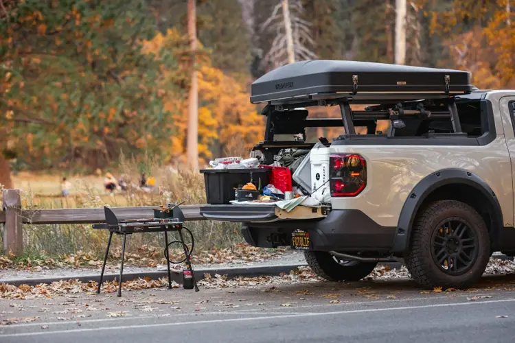Road trip snacks and supplies packed neatly inside car trunk.