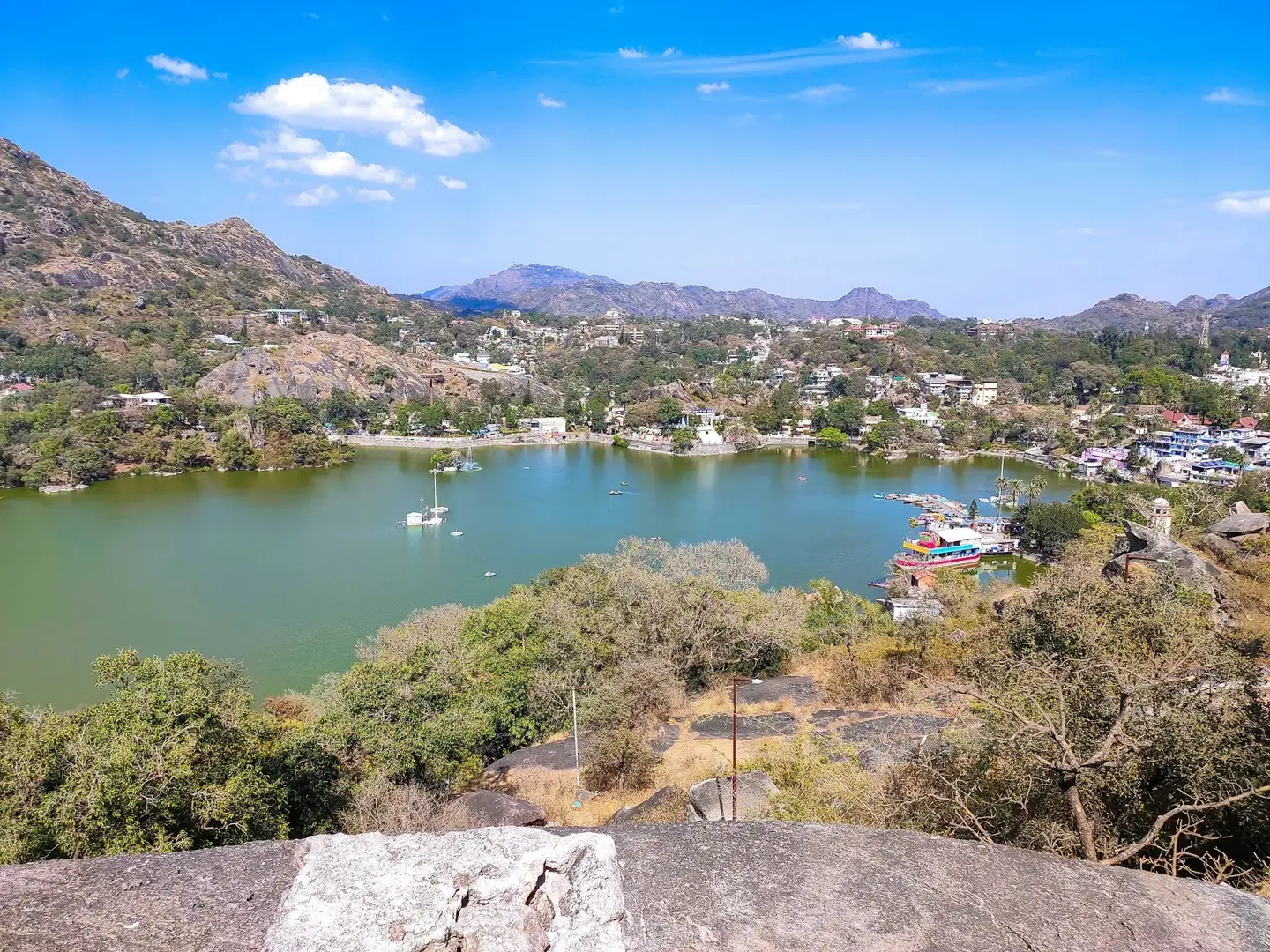 Nakki Lake in Mount Abu surrounded by hills and boats, a popular attraction after arriving on the Ahmedabad to Mount Abu road trip.