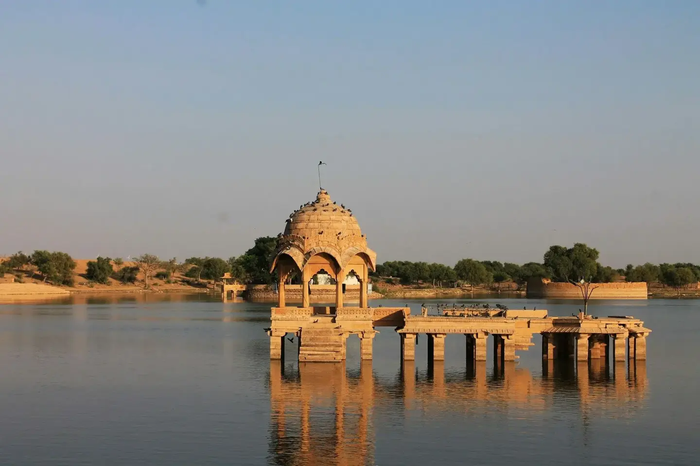 Gadisar Lake arrival view in Rajasthan desert at sunset.