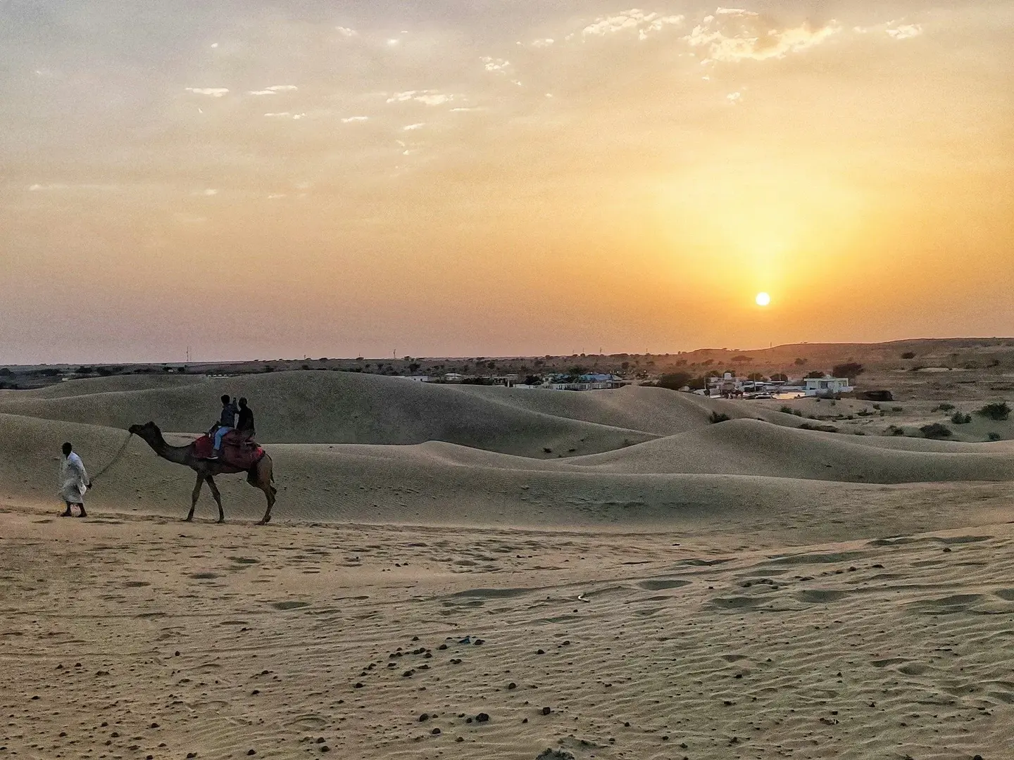 Sunset view of Jaisalmer city and surrounding desert landscape in Rajasthan.
