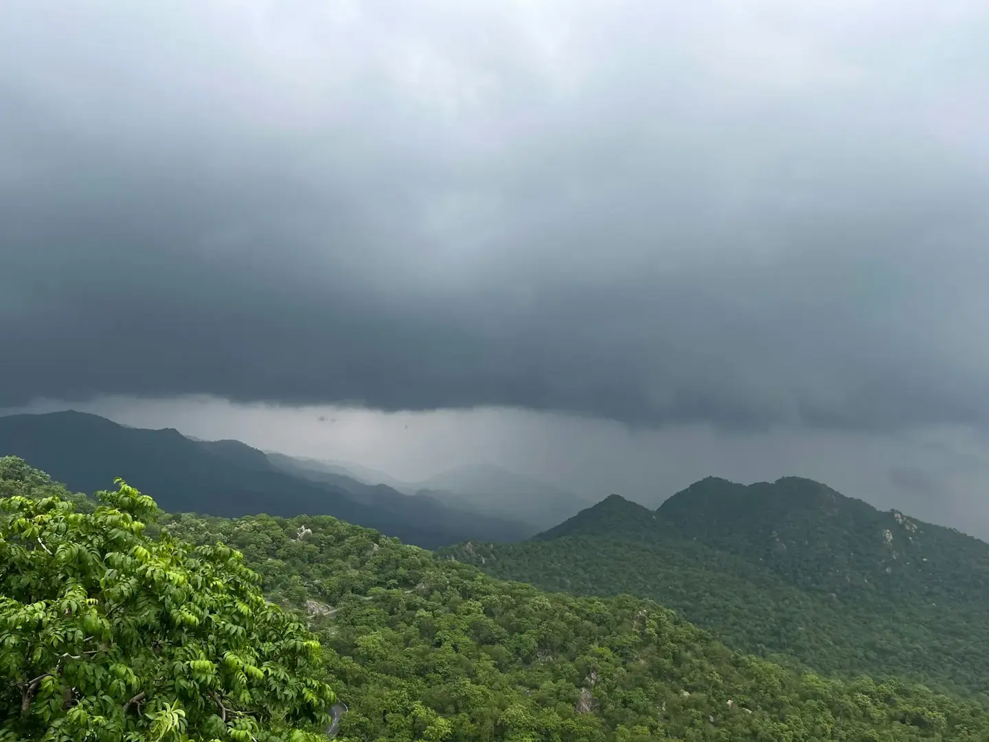 Scenic view of the Aravalli mountain range under cloudy skies near Mount Abu on the Udaipur to Mount Abu road trip.