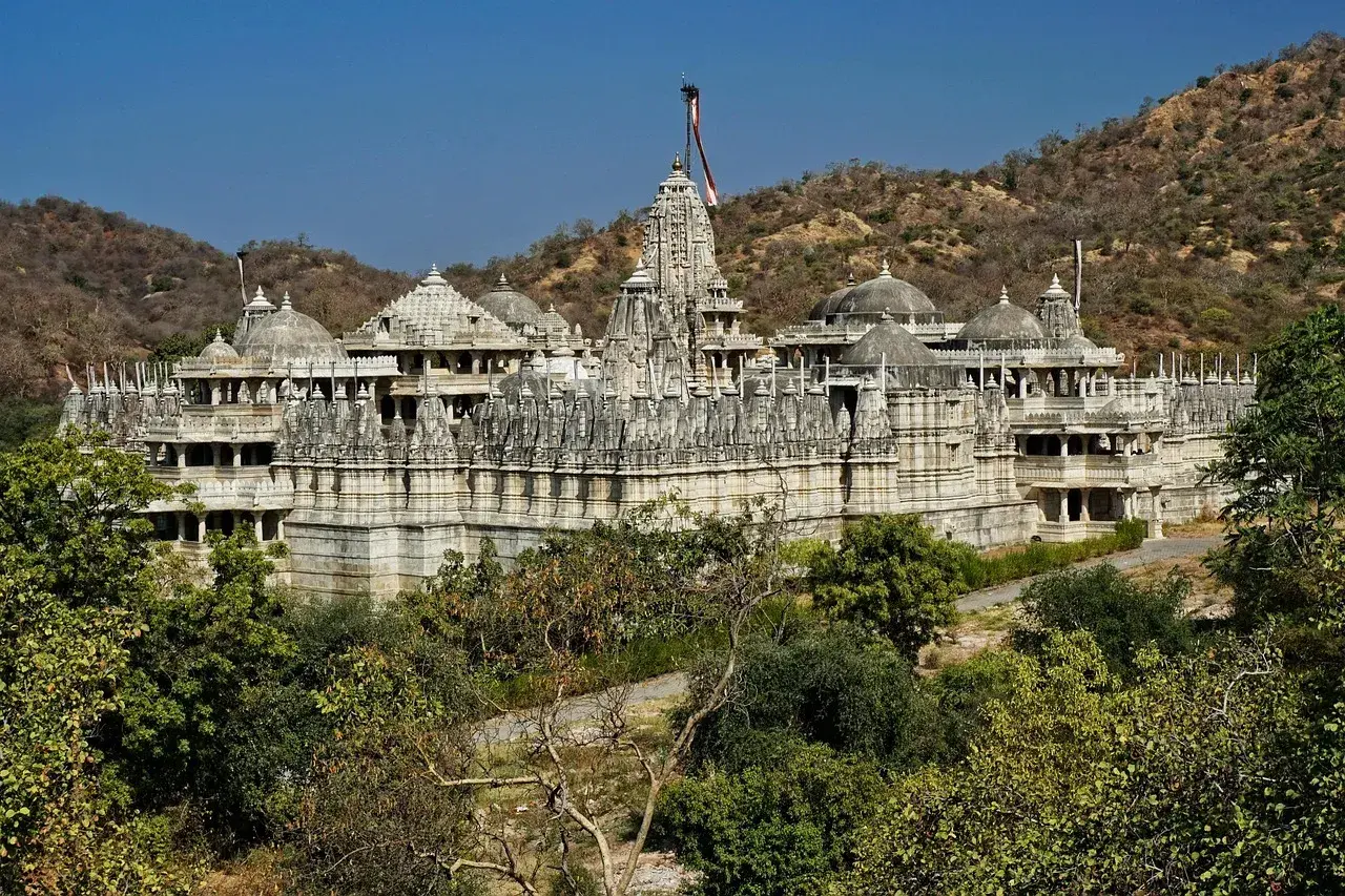 Ranakpur Jain Temple surrounded by Aravalli hills marking the destination of the Udaipur to Ranakpur road trip.